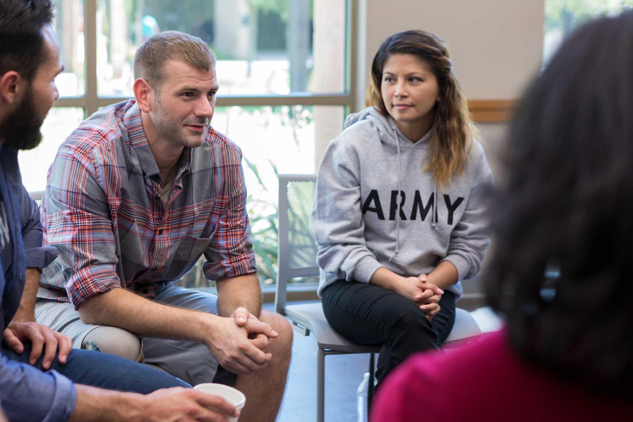 iStock-1173363337-web people gathered in substance use treatment group