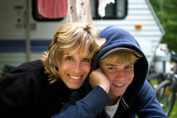 A mother and child smiling for the camera.
